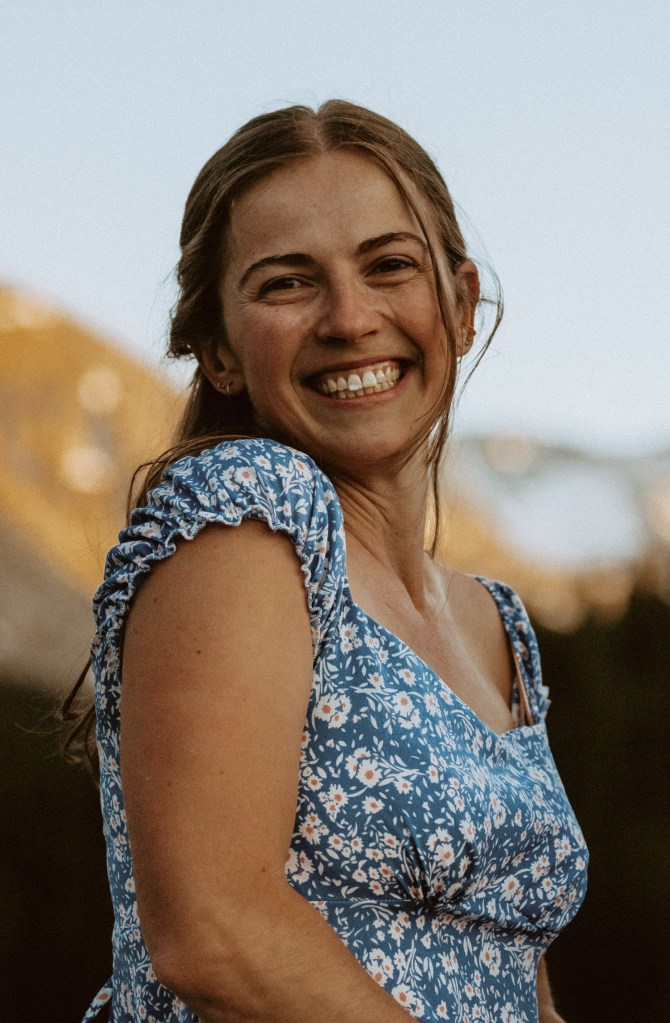 headshot of a tailor at forget me not sewing